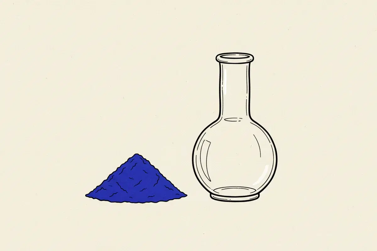 Illustration of a pile of blue powder next to a glass beaker