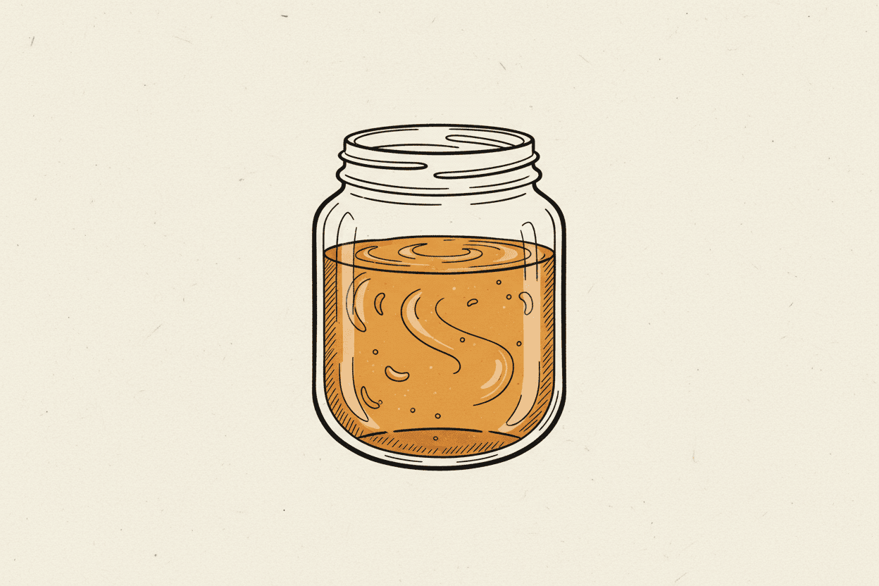 Illustration of a clear glass jar filled with a viscous amber liquid