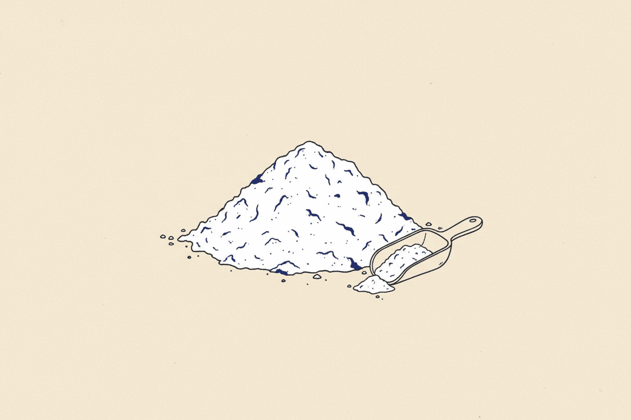 Illustration of a pile of white powder next to a small scoop