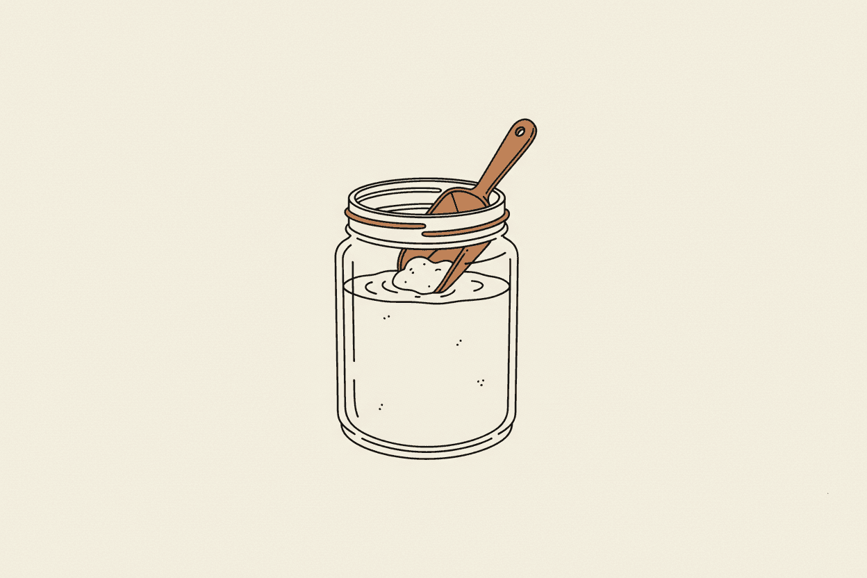 Illustration of a glass jar filled with a cloudy liquid and a scoop