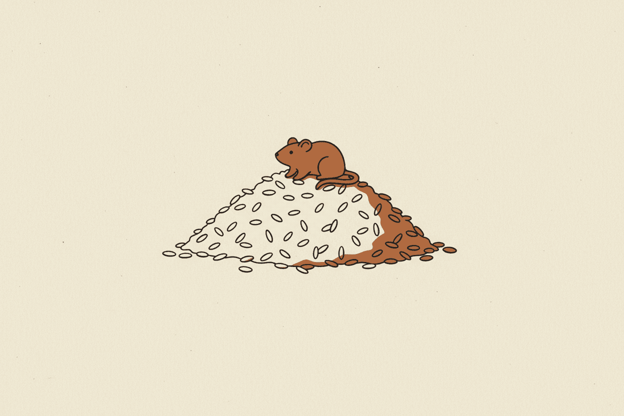 Illustration of a pile of rice with a small rodent figurine on top