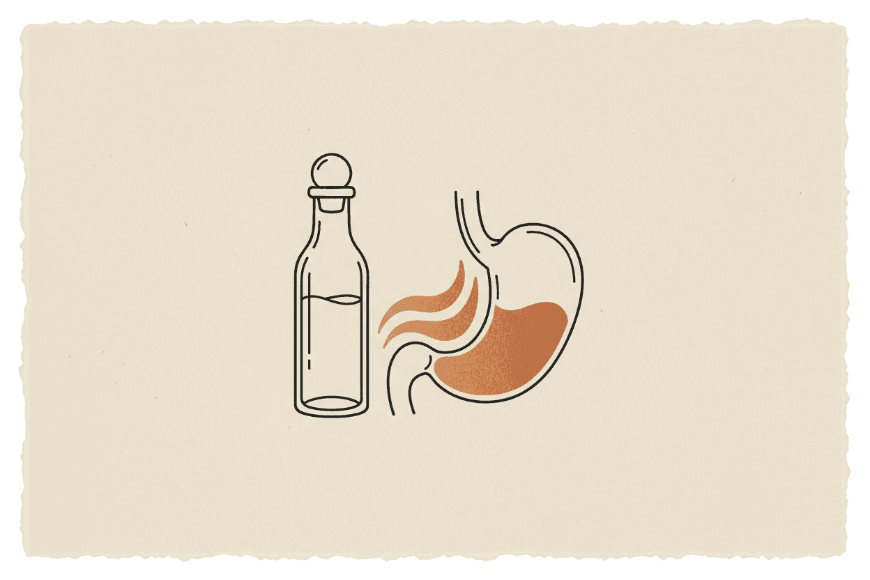 Illustration of a glass bottle filled with a clear liquid next to a stomach model